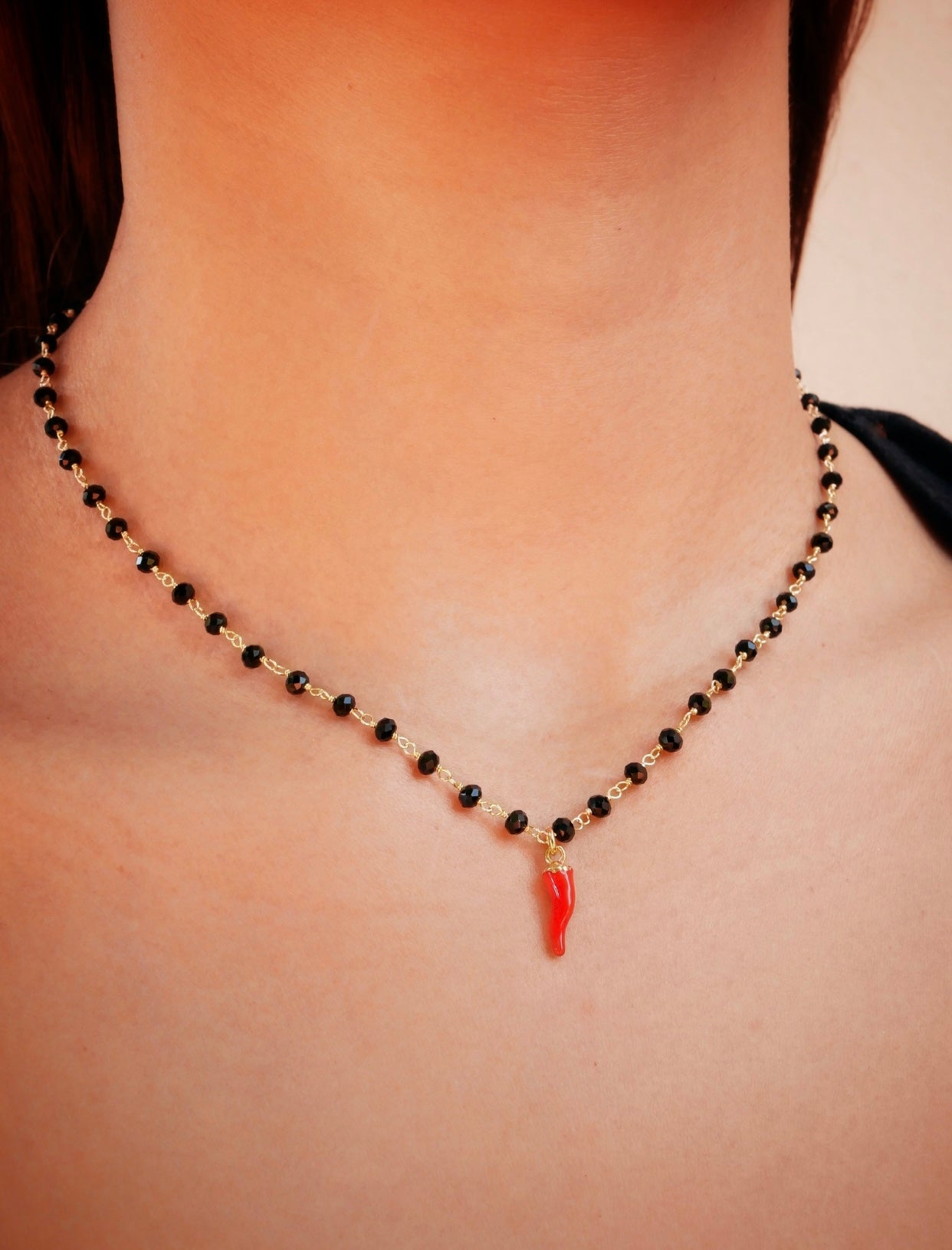 Collana in argento con cornetto e sfere